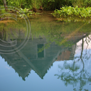 farmhouse reflected in the spring