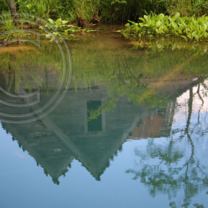 farmhouse reflected in the spring